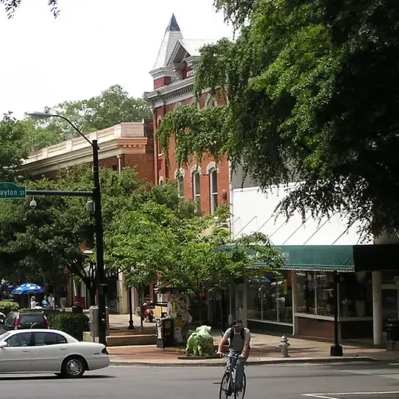 Historic brick storefronts and shops on Clayton Street in Athens, GA