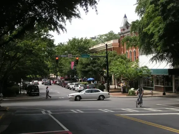 Tree-lined East Clayton Street in downtown Athens, GA where local business owners sell and buy businesses