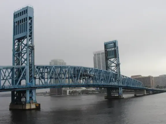 Blue lift towers of the Main Street Bridge crossing the St. Johns River in downtown Jacksonville, Florida