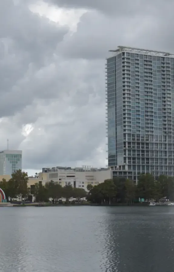 Downtown Orlando towers rising behind Lake Eola, where owners work with business brokers in Orlando to sell their companies