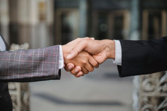Two business professionals shaking hands