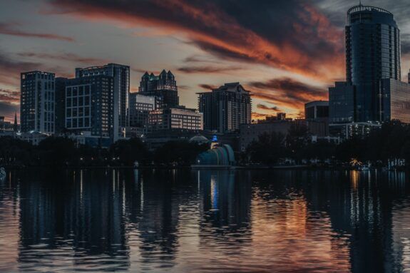 Orlando, Florida skyline at dusk reflected on the lake