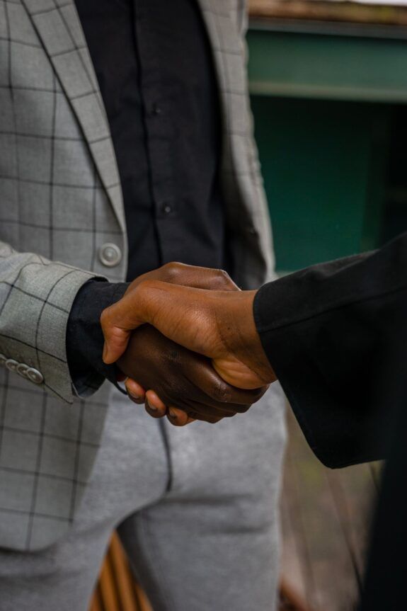 Close-up of two people shaking hands