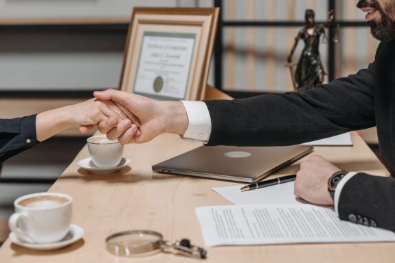 People shaking hands to close a business contract