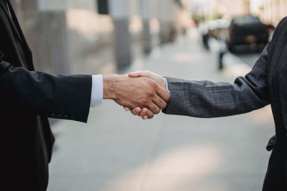Close-up of business people shaking hands