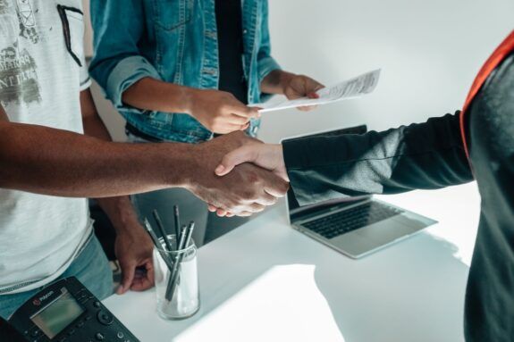People completing a business handshake