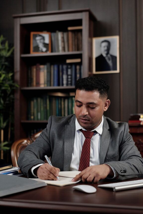 Businessman signing a document