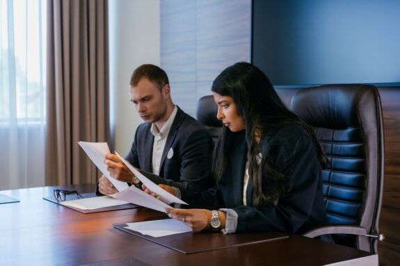 Professionals reviewing documents in a meeting