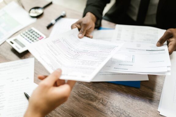 Advisor handing over business documents