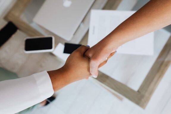 Two professionals shaking hands