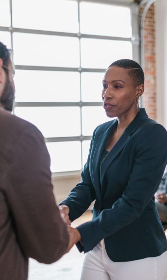 Business people exchanging a handshake in an office