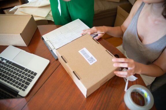 Ecommerce brand team packing customer orders together