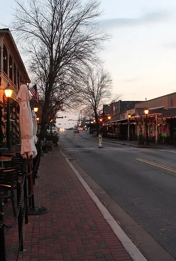 Historic downtown Roswell, GA at dusk, home market for business brokers Roswell owners rely on to sell or buy a business