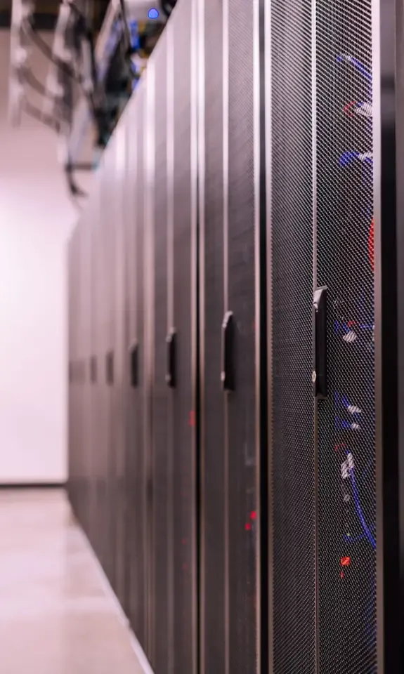 Row of server racks in a hosting data center, the infrastructure owners look at when they sell a web hosting company